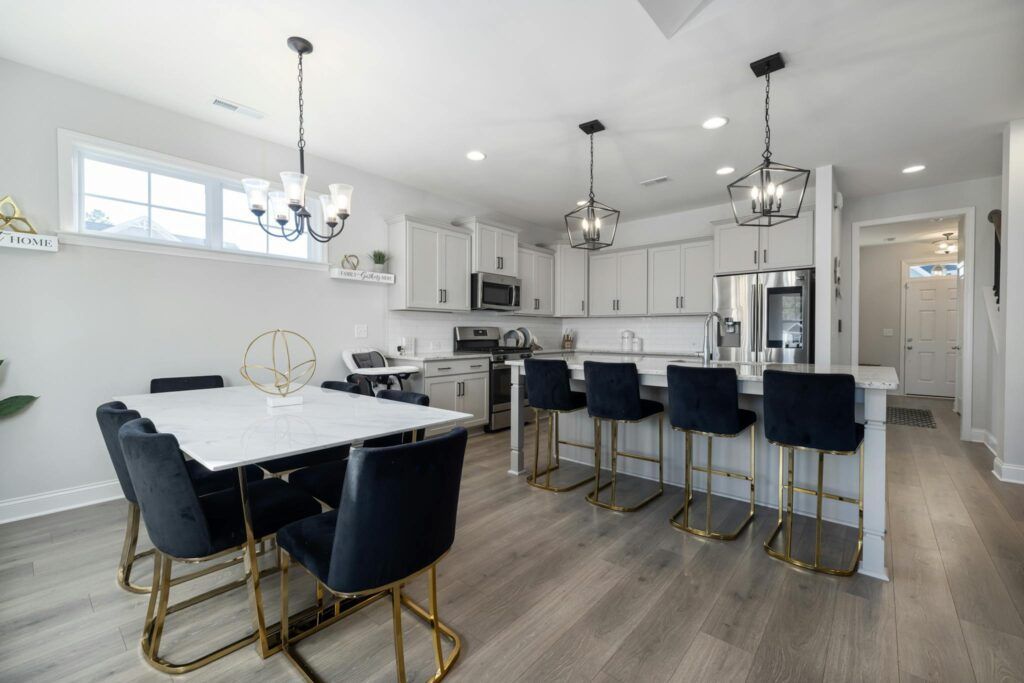 Sleek open floor plan kitchen with luxury finishes and modern decor.