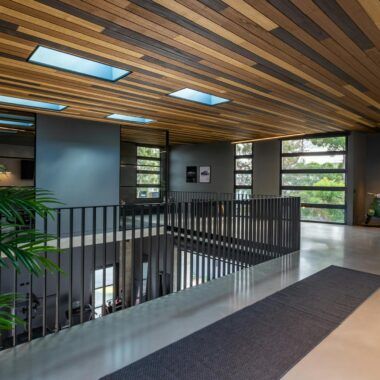 Stylish contemporary open-plan interior with wooden accents and natural light.